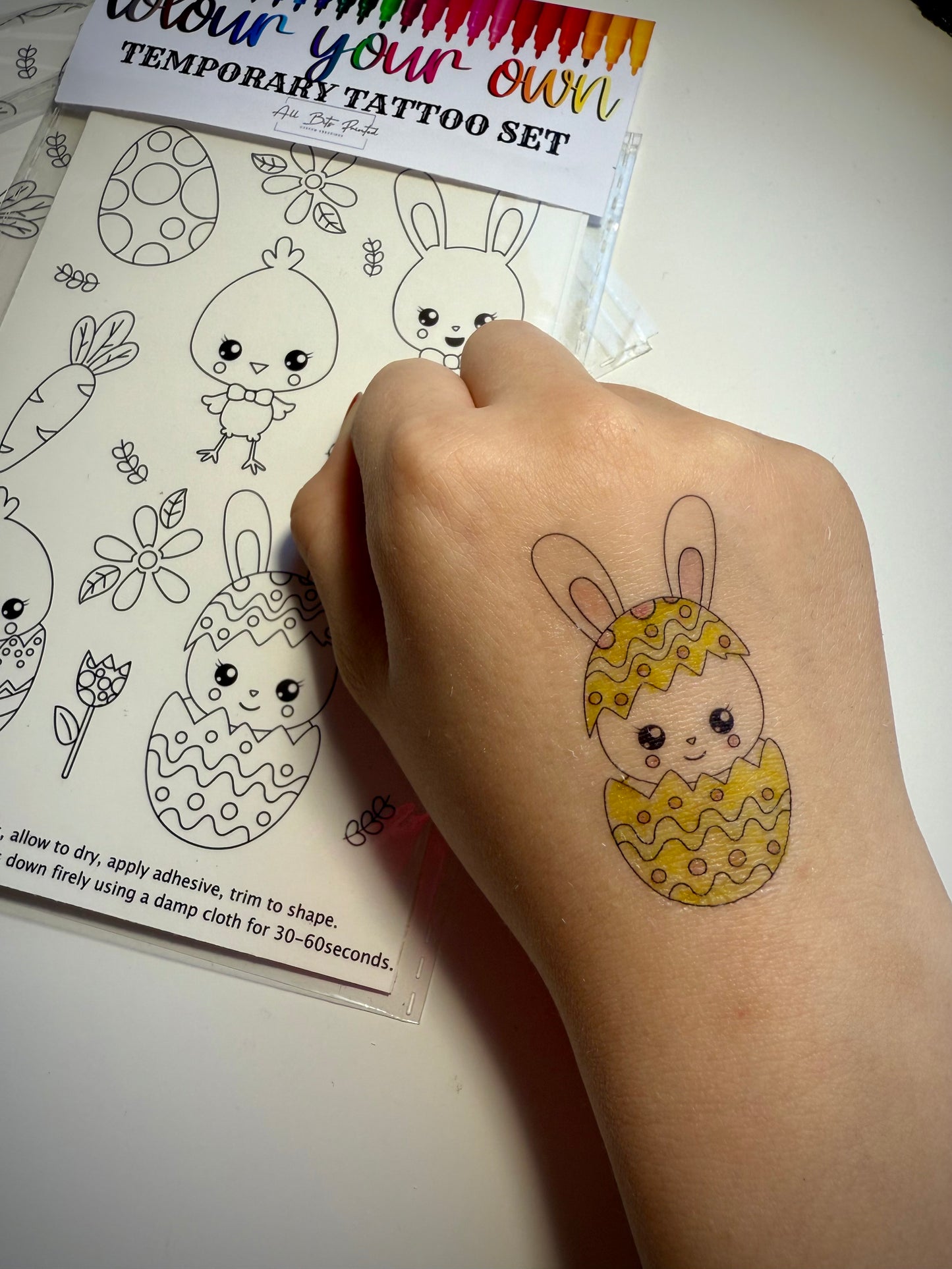 Colorable Easter temporary tattoos with bunny and egg designs for children's holiday activities"