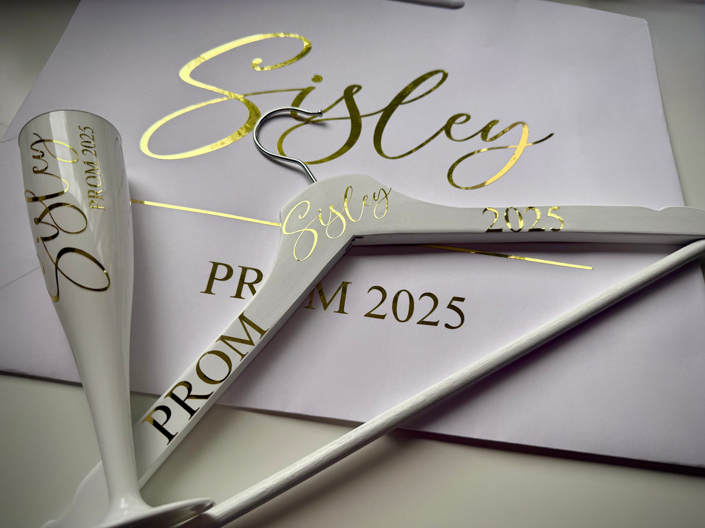 Personalized prom gift set with custom champagne flute, decorative hanger and gift bag for 2025 graduation celebration