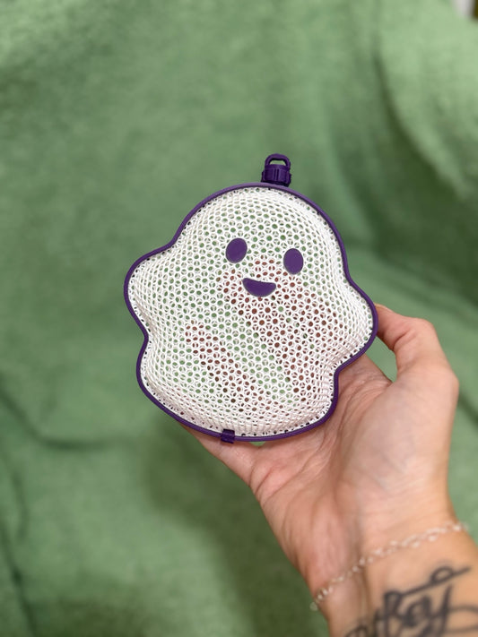 White and purple 3D printed Halloween ghost treat holder filled with Celebration chocolates
